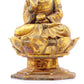 A serene gilt bronze statue of Gautama Buddha