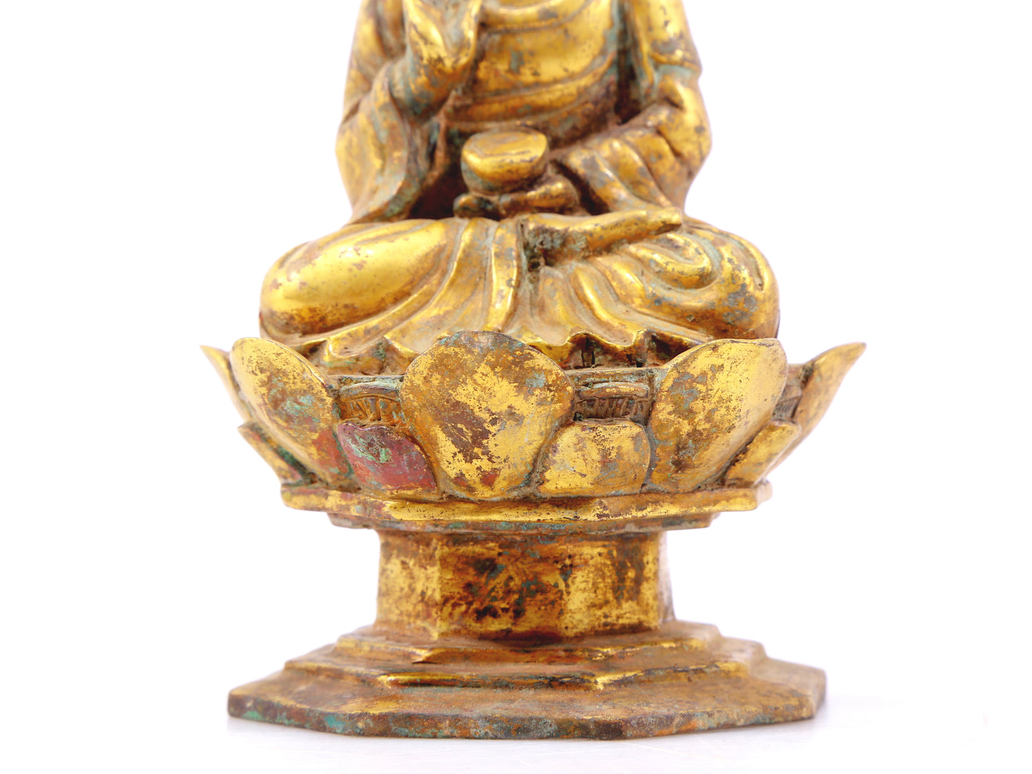 A serene gilt bronze statue of Gautama Buddha