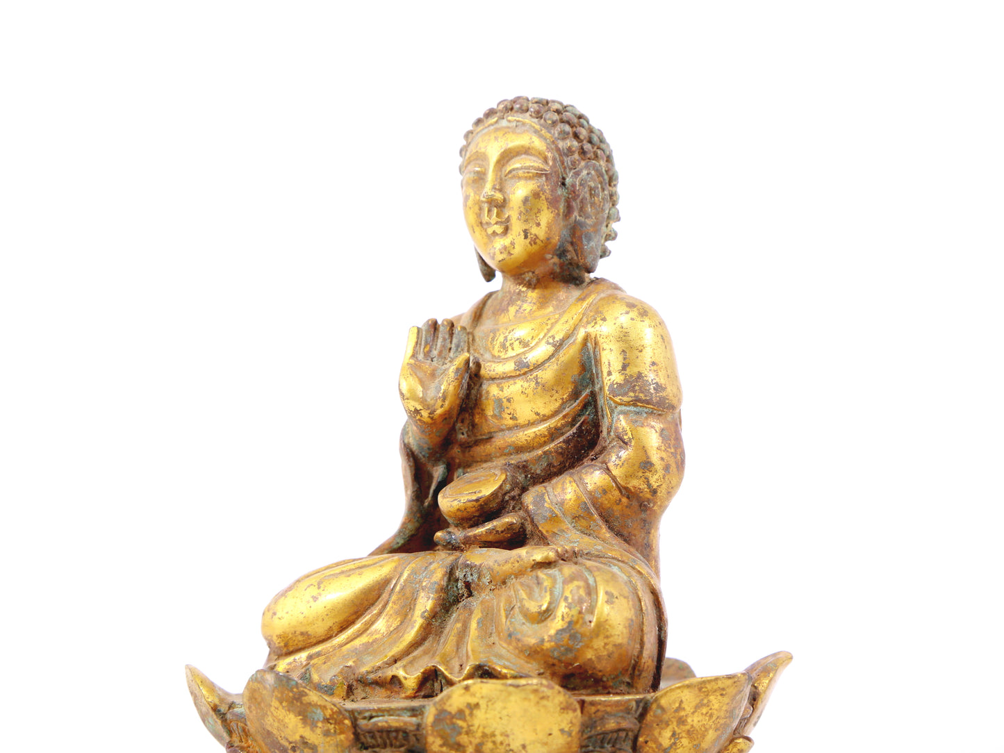 A serene gilt bronze statue of Gautama Buddha