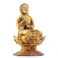 A serene gilt bronze statue of Gautama Buddha