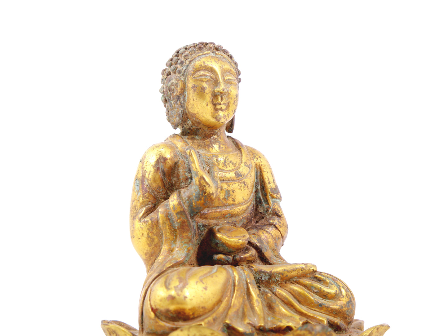 A serene gilt bronze statue of Gautama Buddha