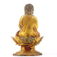 A serene gilt bronze statue of Gautama Buddha