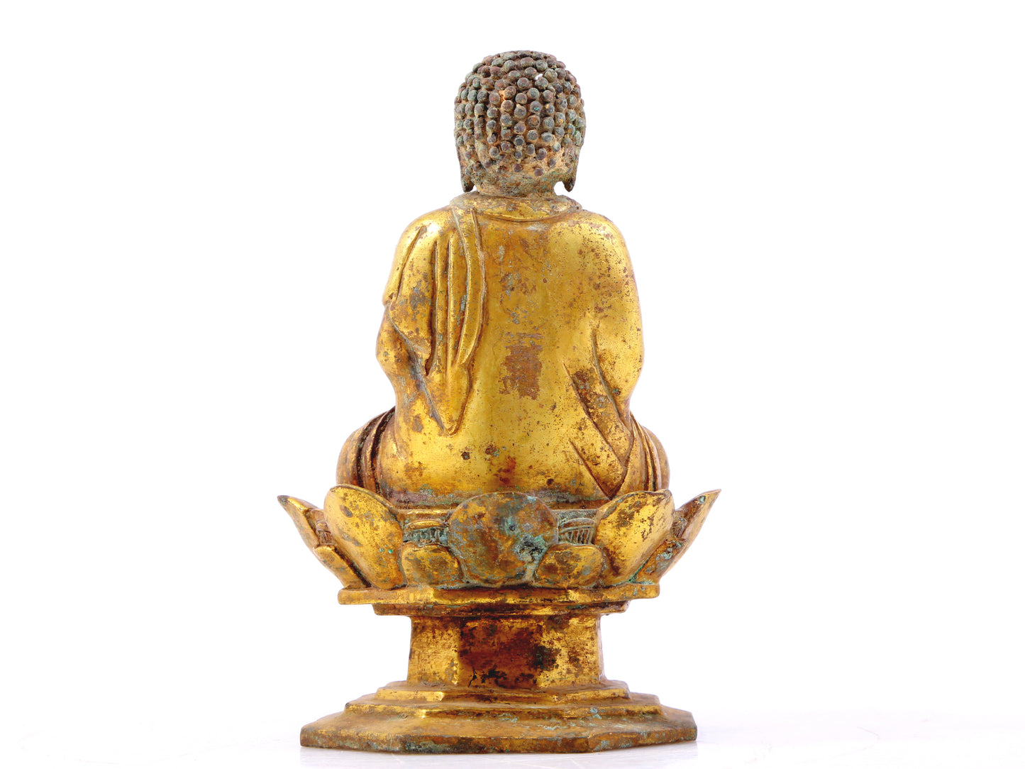 A serene gilt bronze statue of Gautama Buddha