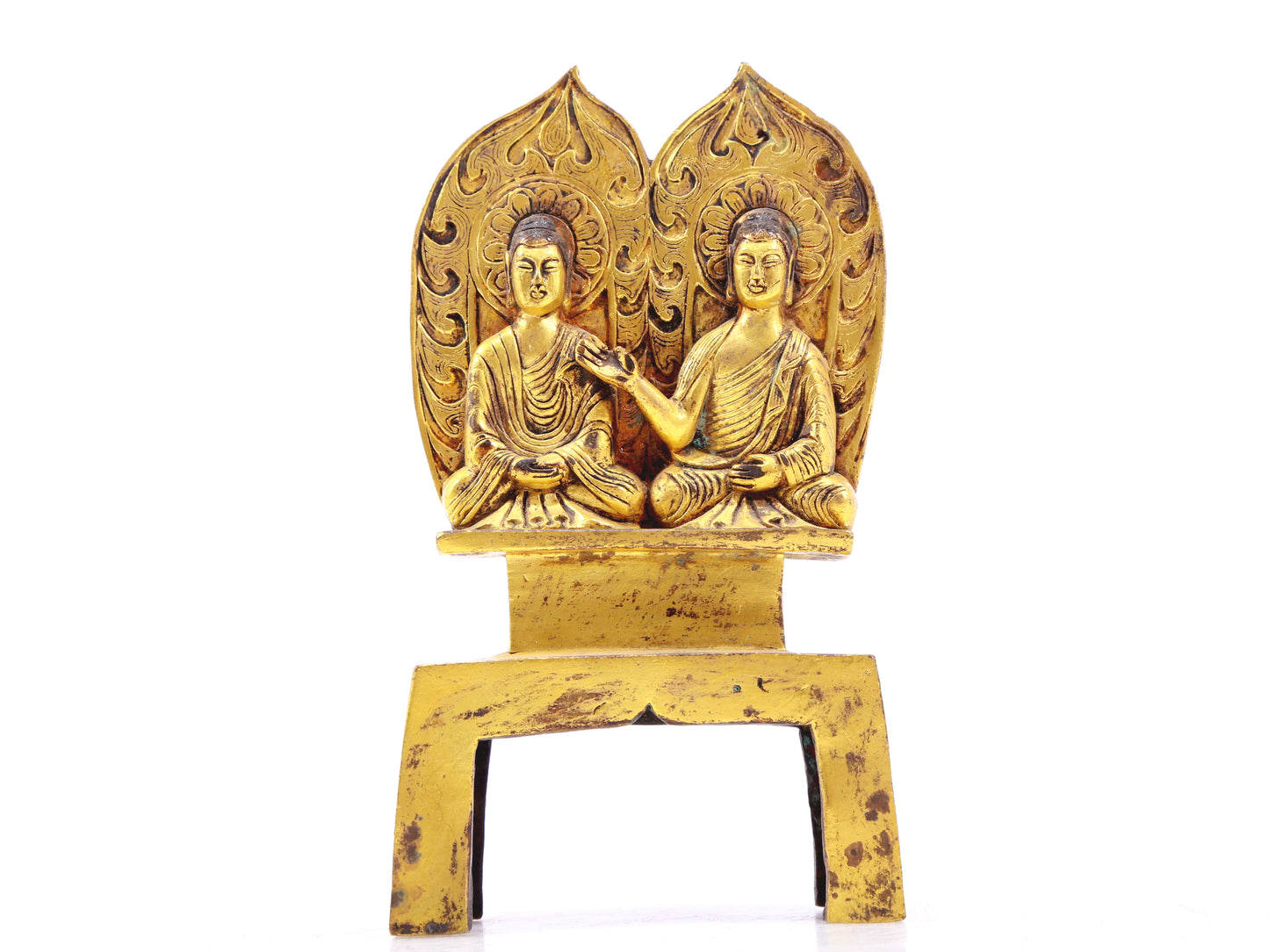 A serene gilt bronze statue of Gautama Buddha