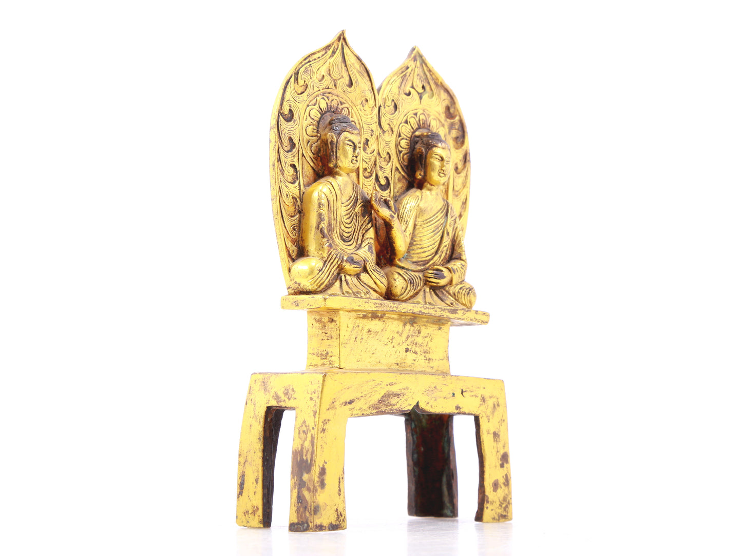 A serene gilt bronze statue of Gautama Buddha