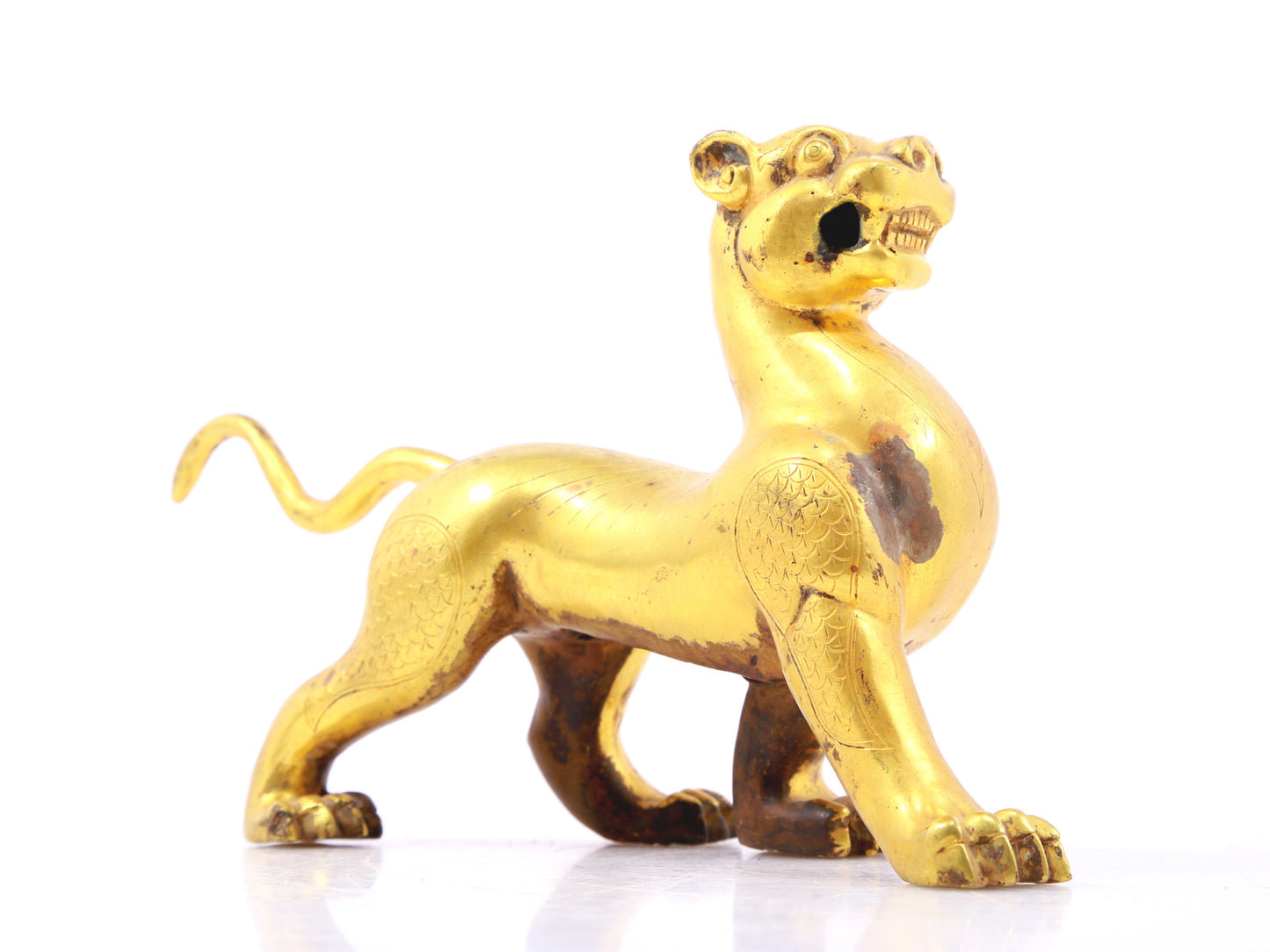 An exquisite gilt bronze leopard ornament