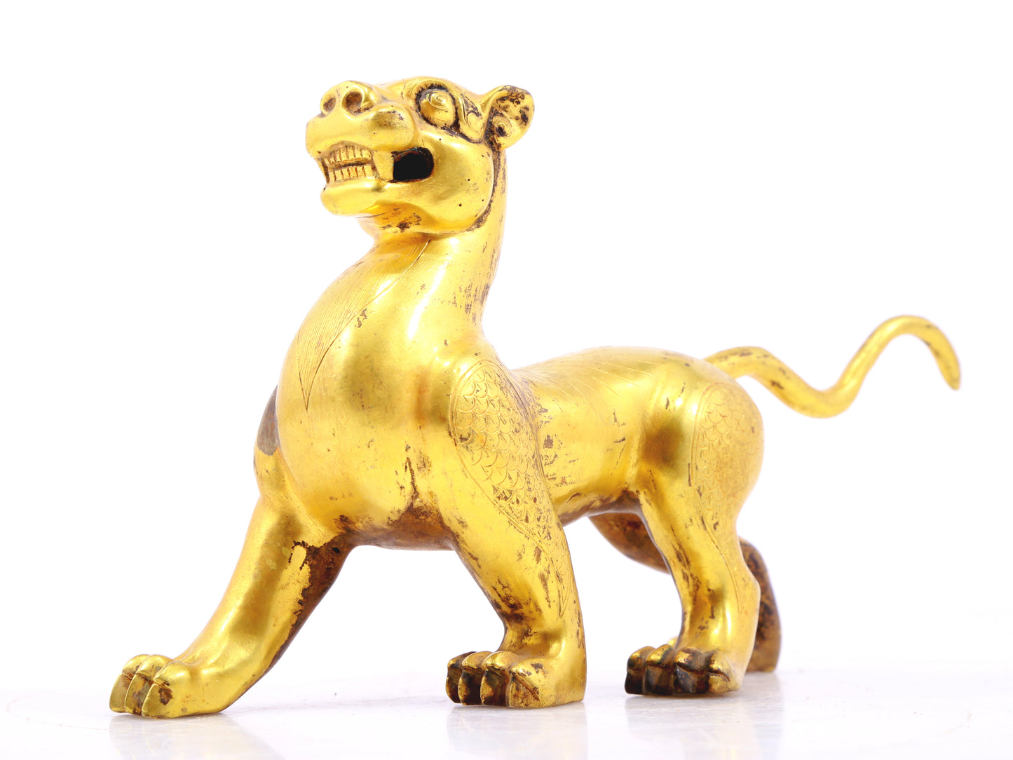 An exquisite gilt bronze leopard ornament