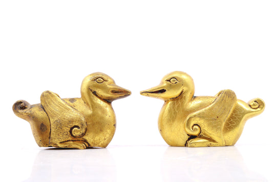 A pair of exquisite gilt bronze ducks