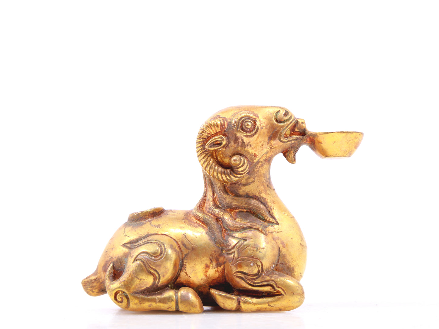 An exquisite gilt bronze goat figurine