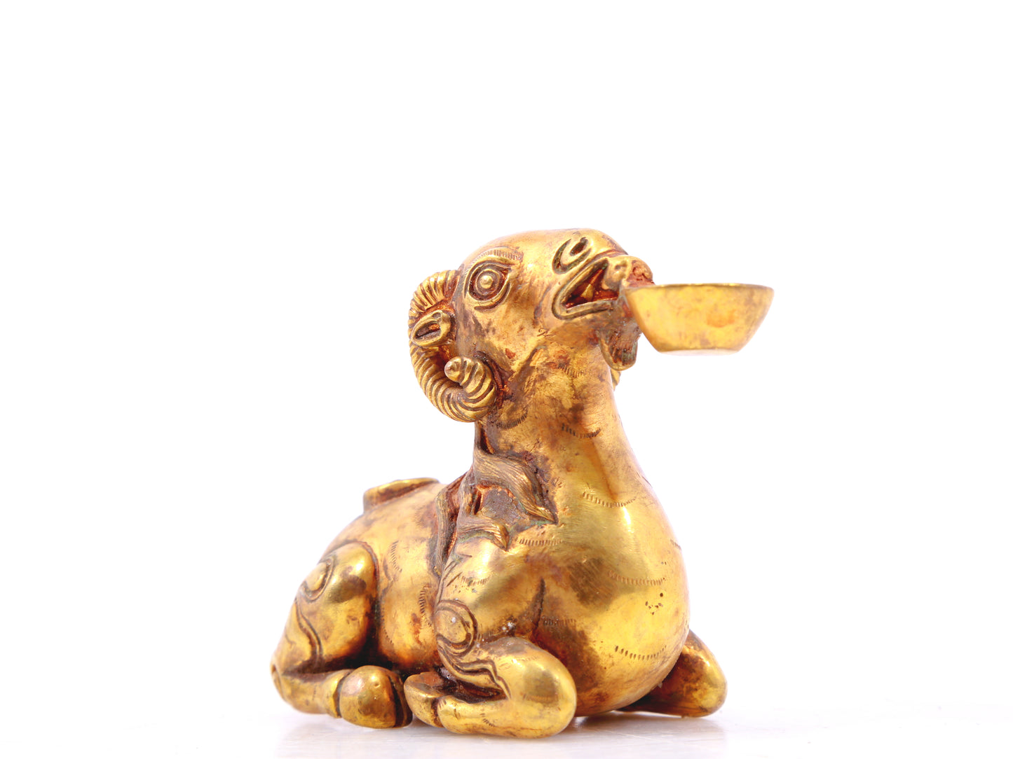 An exquisite gilt bronze goat figurine