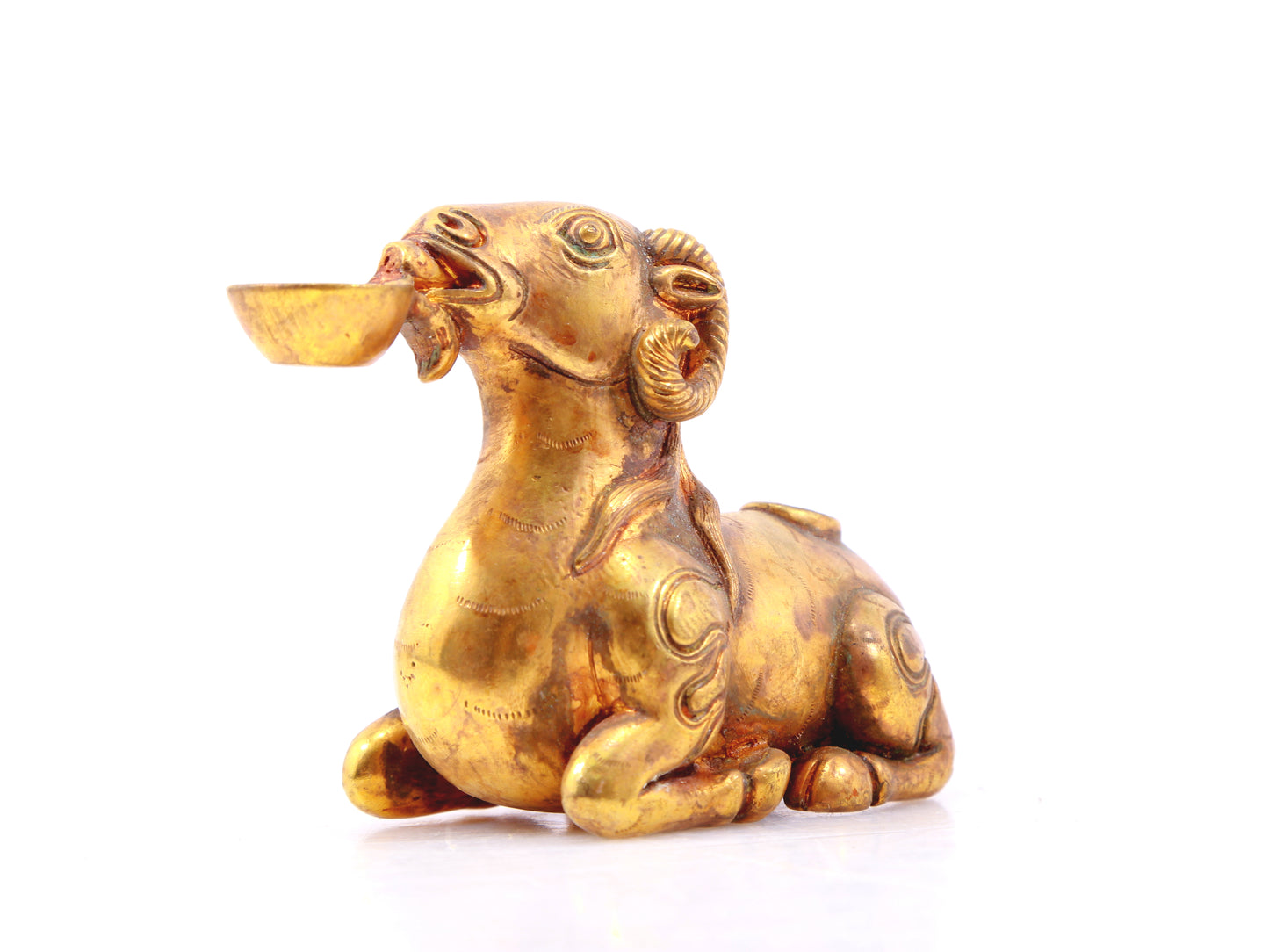 An exquisite gilt bronze goat figurine