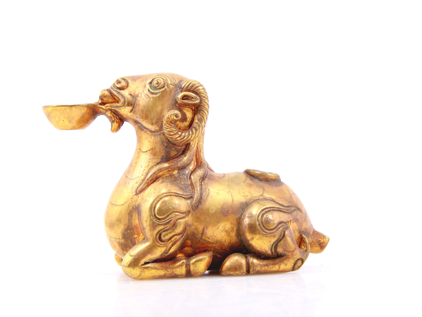 An exquisite gilt bronze goat figurine