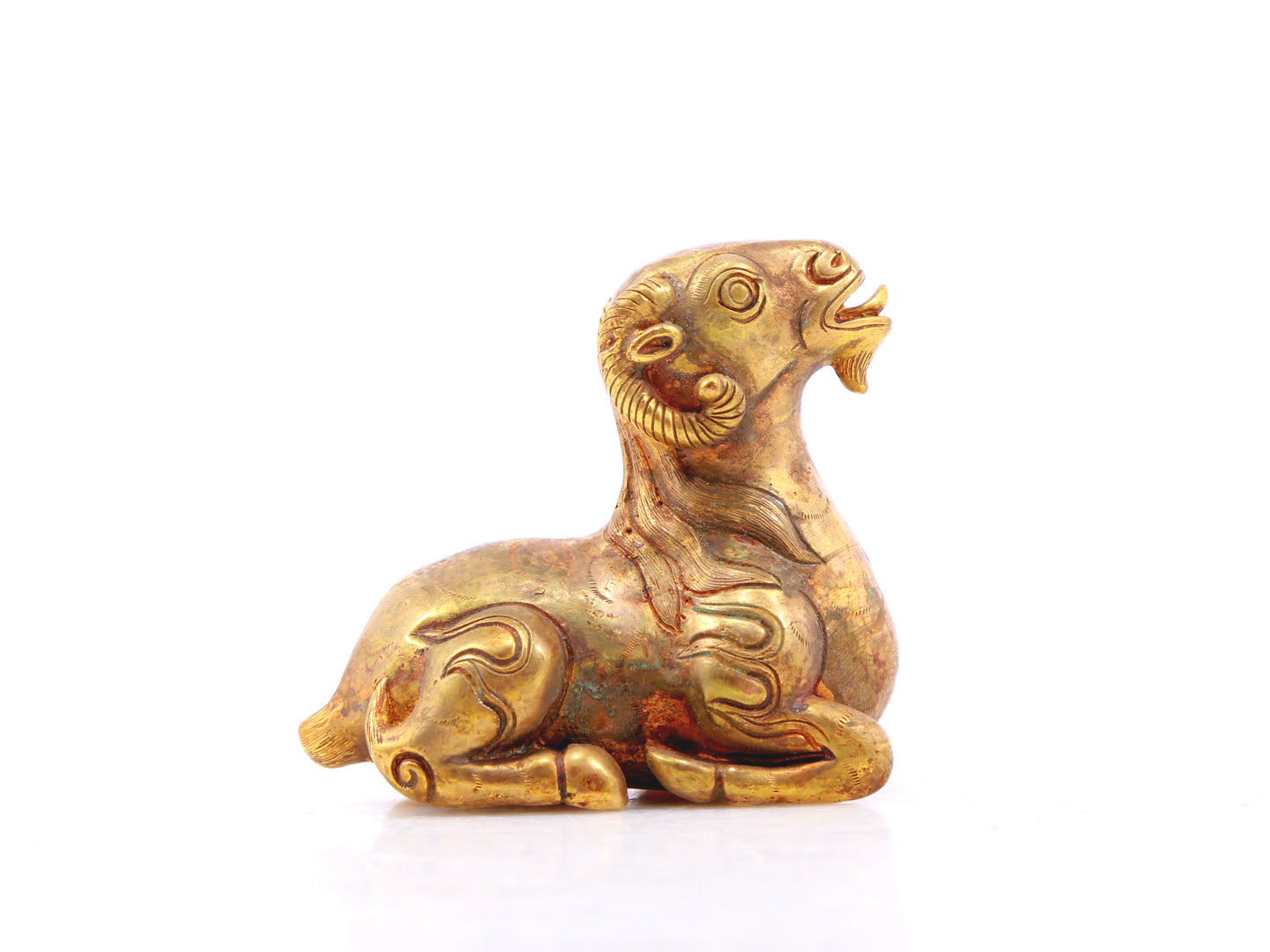 An exquisite gilt bronze goat figurine