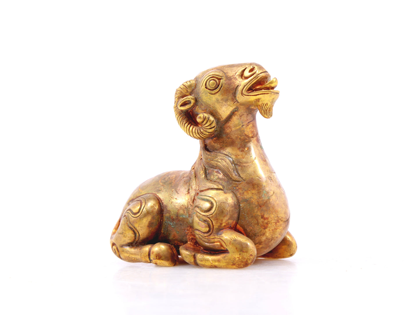 An exquisite gilt bronze goat figurine