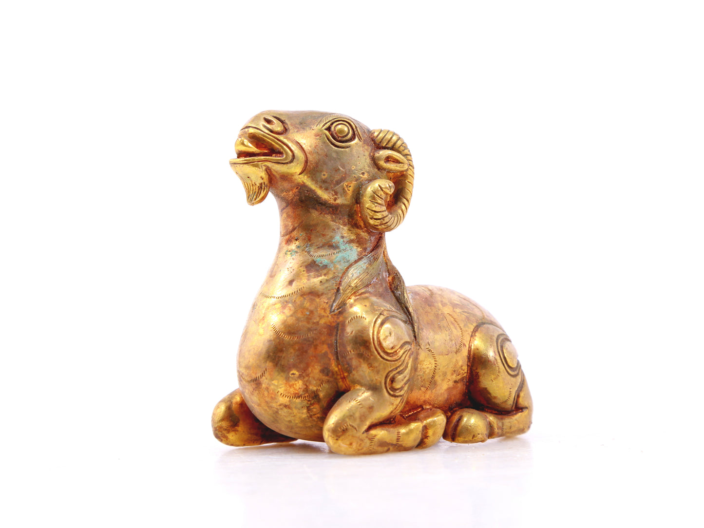 An exquisite gilt bronze goat figurine