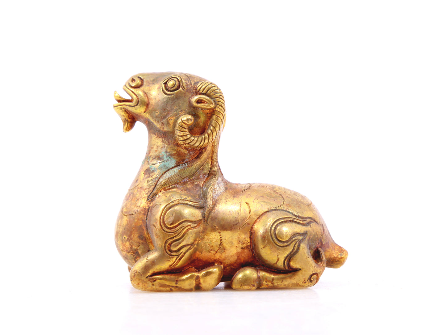 An exquisite gilt bronze goat figurine