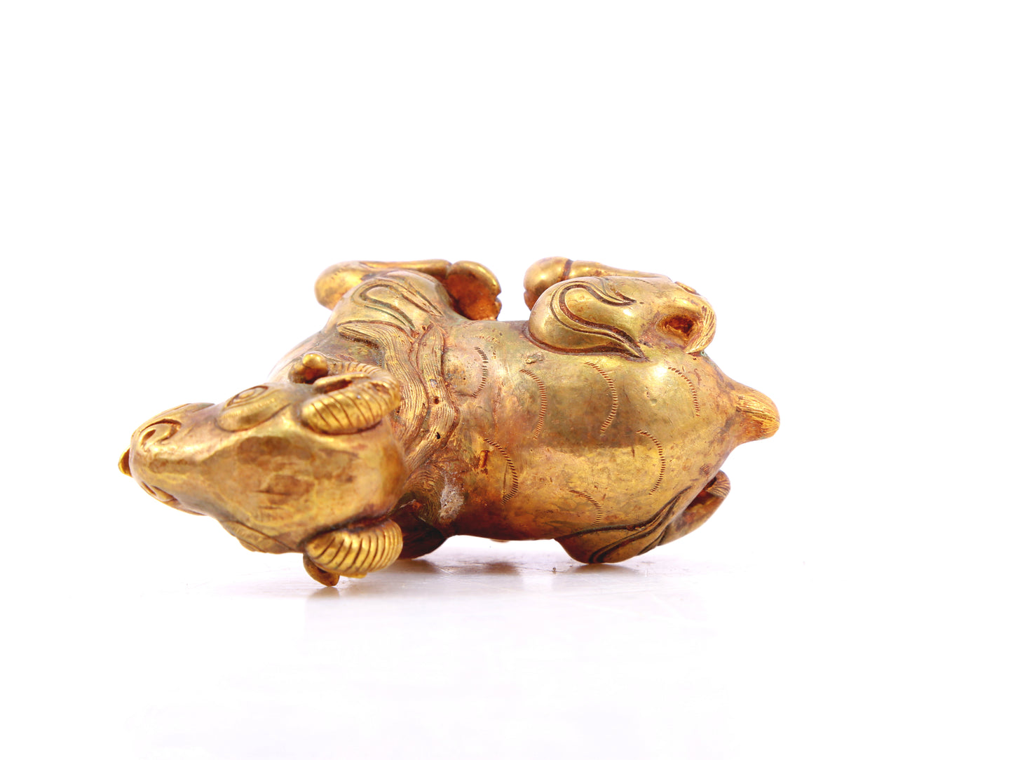 An exquisite gilt bronze goat figurine