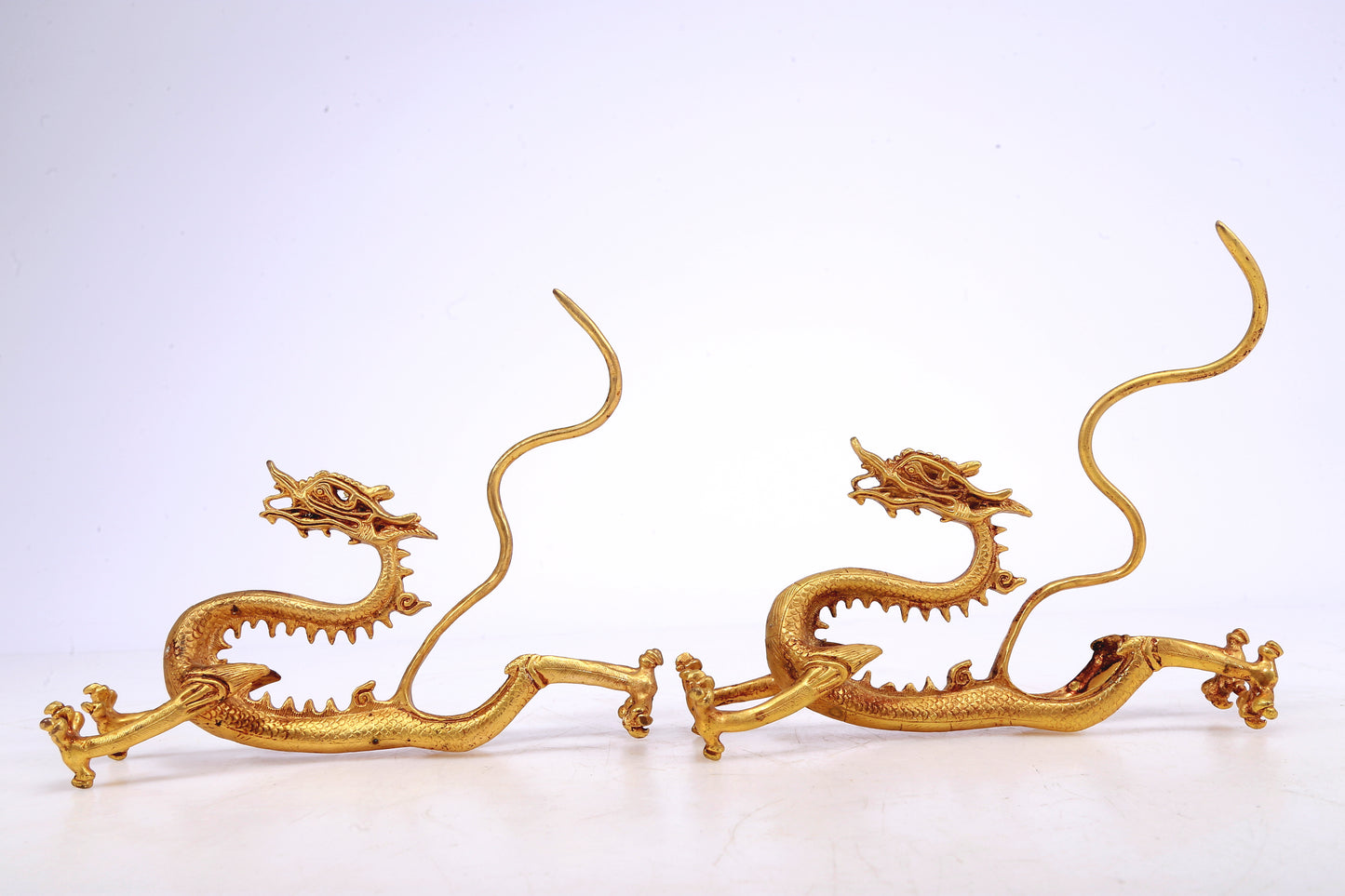 A Brilliant Pair Of Gilt-Bronze Dragons