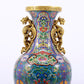 An exquisite cloisonné vase with lotus pattern and phoenix ears