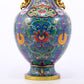 An exquisite cloisonné vase with lotus pattern and phoenix ears