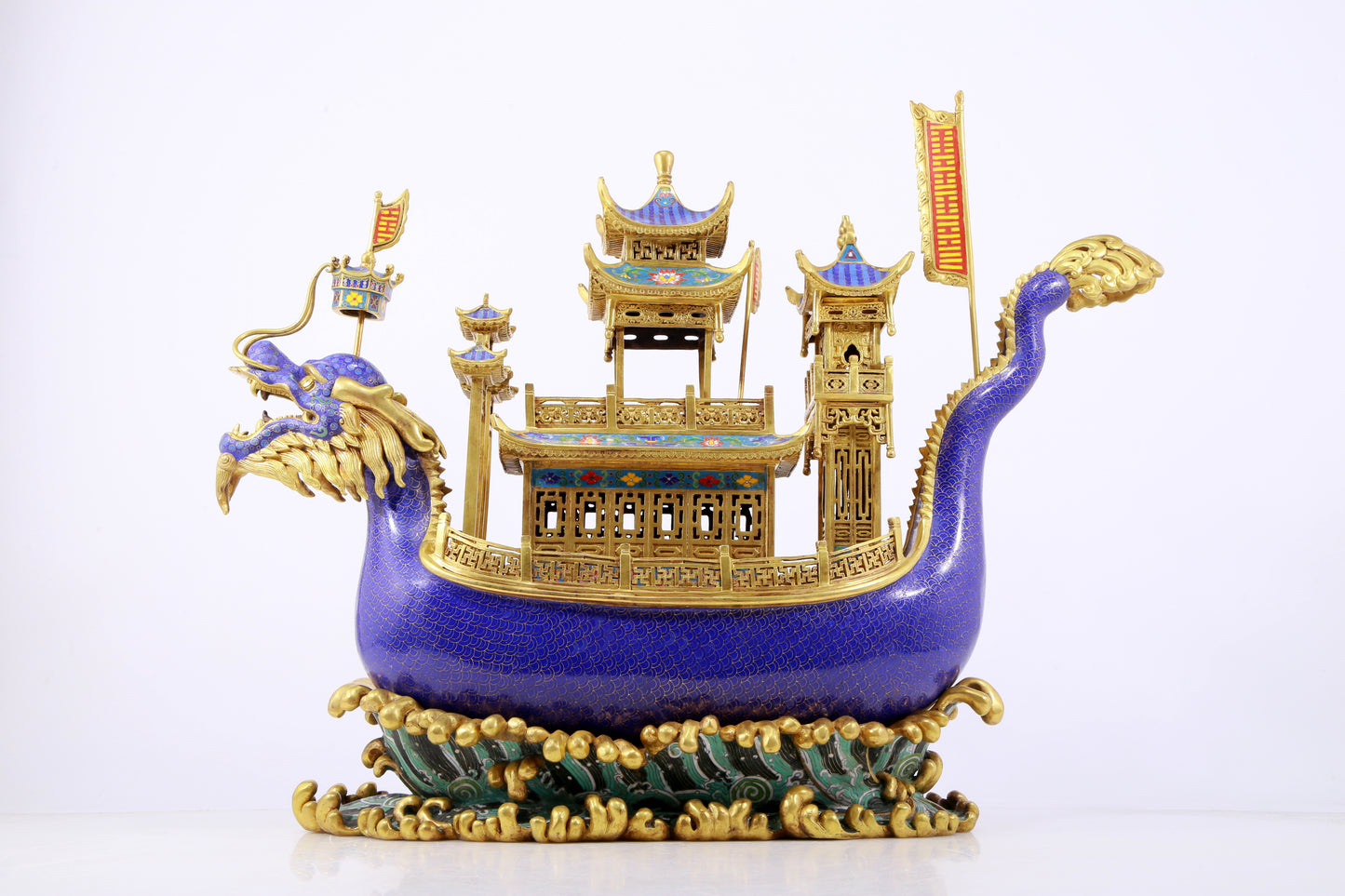 A stunning cloisonné dragon boat ornament