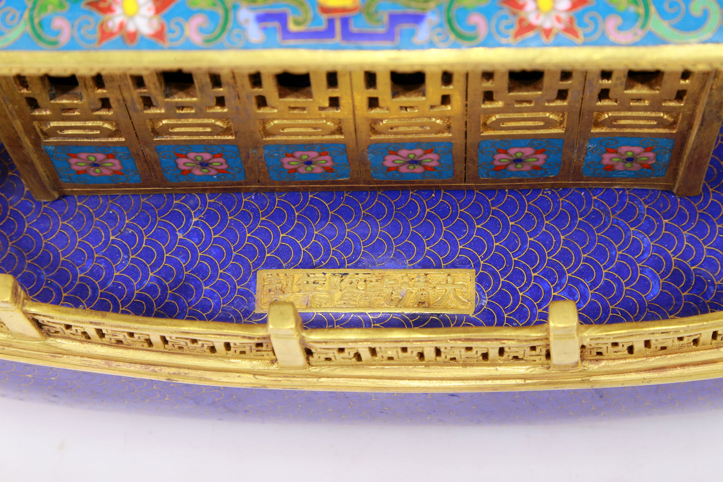 A stunning cloisonné dragon boat ornament