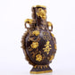 An exquisite gilt copper amphora with floral and auspicious animal patterns