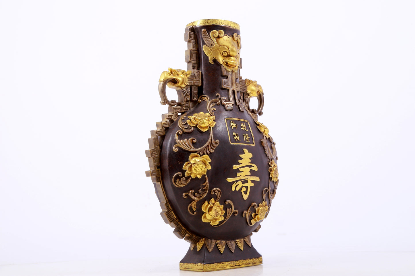 An exquisite gilt copper amphora with floral and auspicious animal patterns