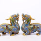 A pair of precious cloisonné unicorn ornaments