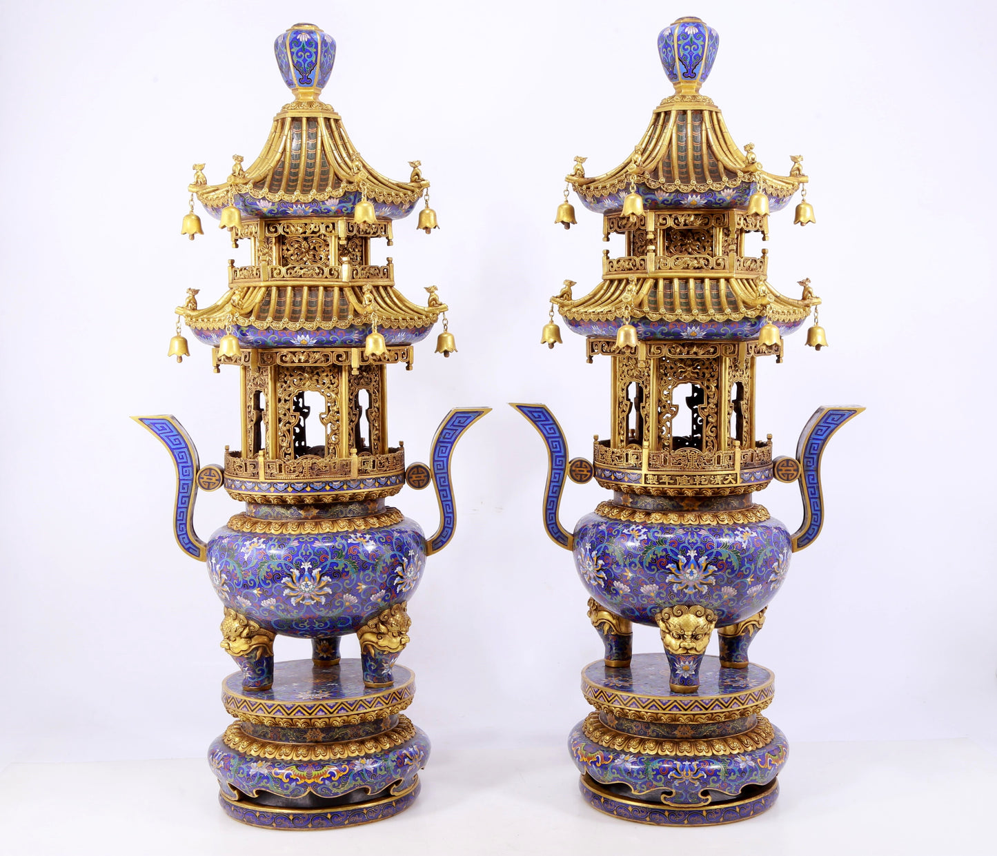 A stunning pair of cloisonné double-eared and tripod censers with twining lotus patterns