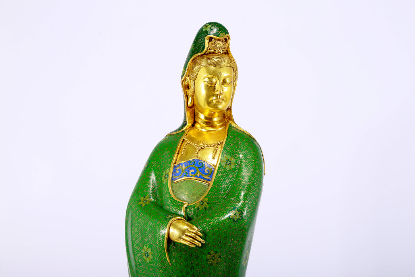 A serene cloisonné statue of Guanyin