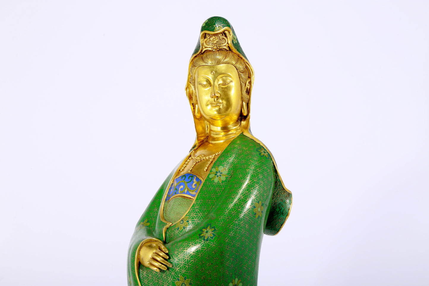 A serene cloisonné statue of Guanyin