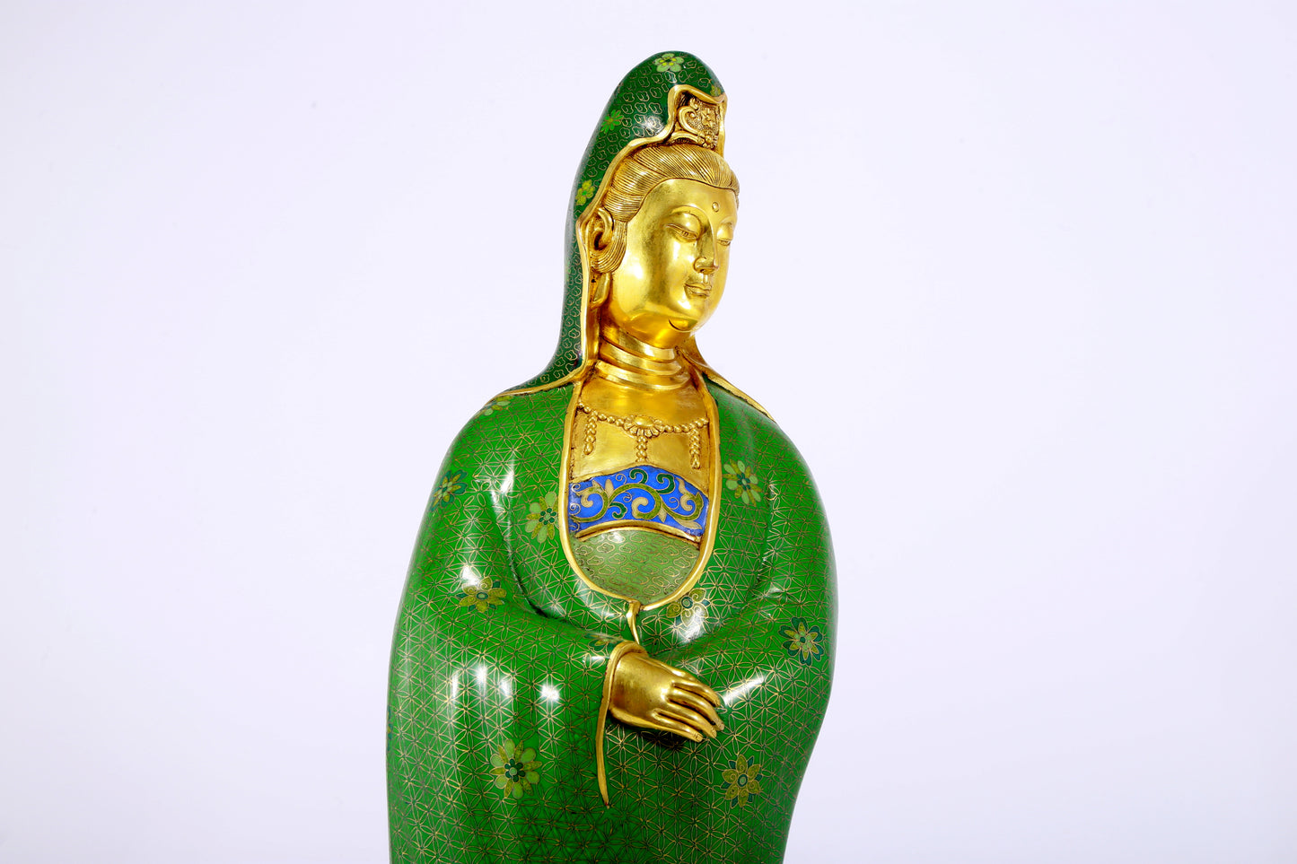 A serene cloisonné statue of Guanyin