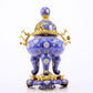 An exquisite cloisonné tangled lotus pattern two-eared tripod censer with lid