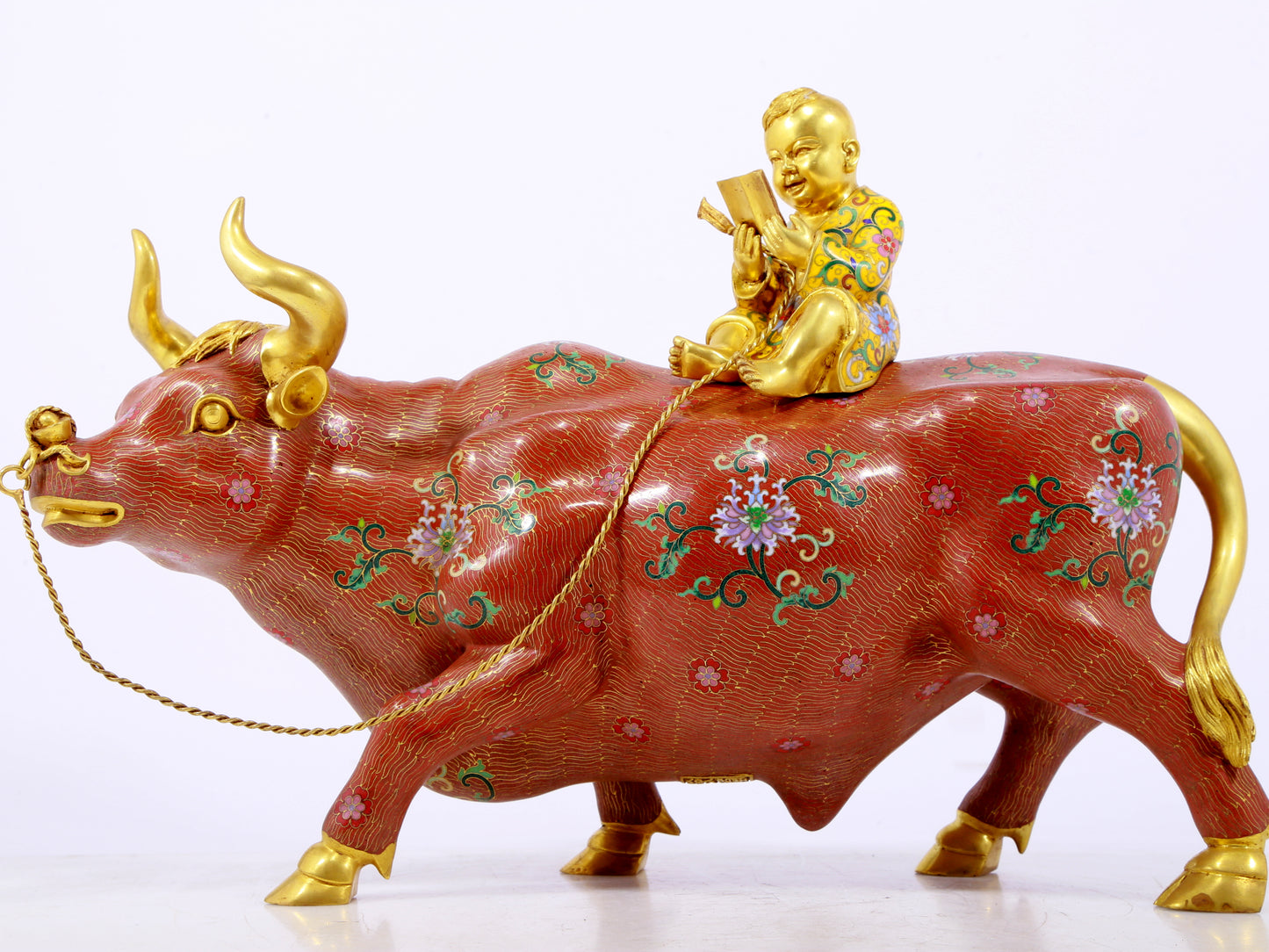 An exquisite cloisonné cow ornament