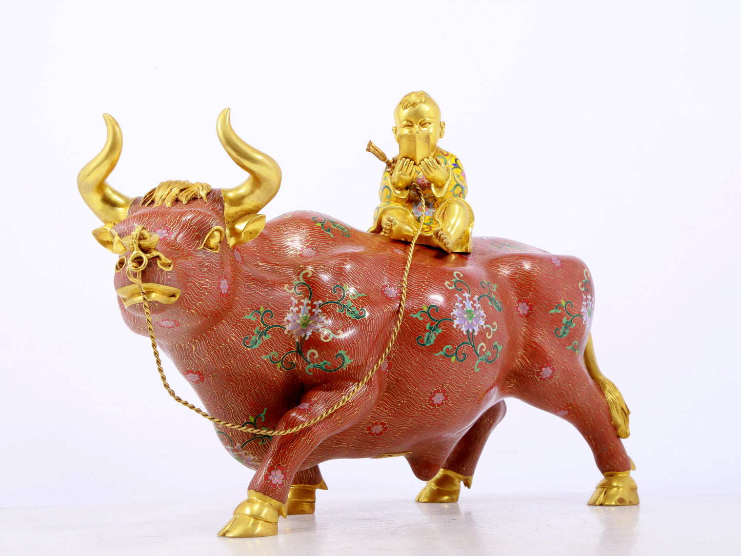 An exquisite cloisonné cow ornament