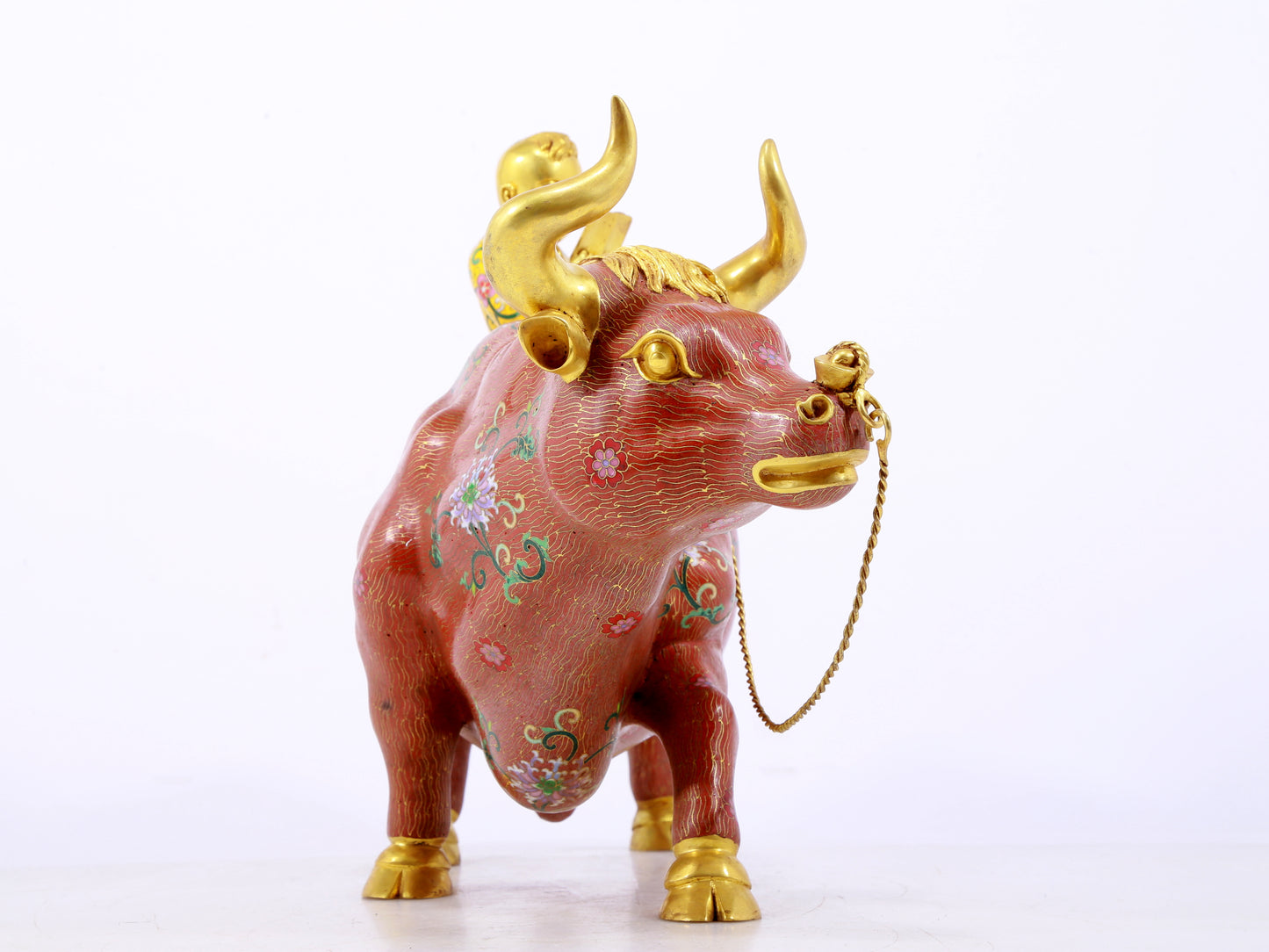 An exquisite cloisonné cow ornament