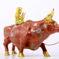 An exquisite cloisonné cow ornament