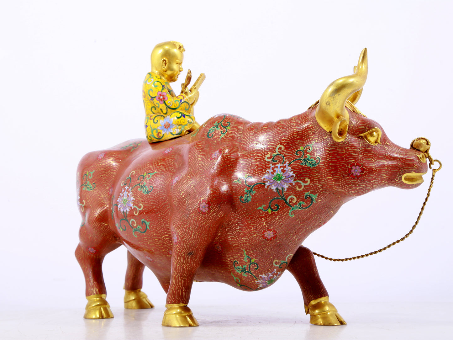 An exquisite cloisonné cow ornament