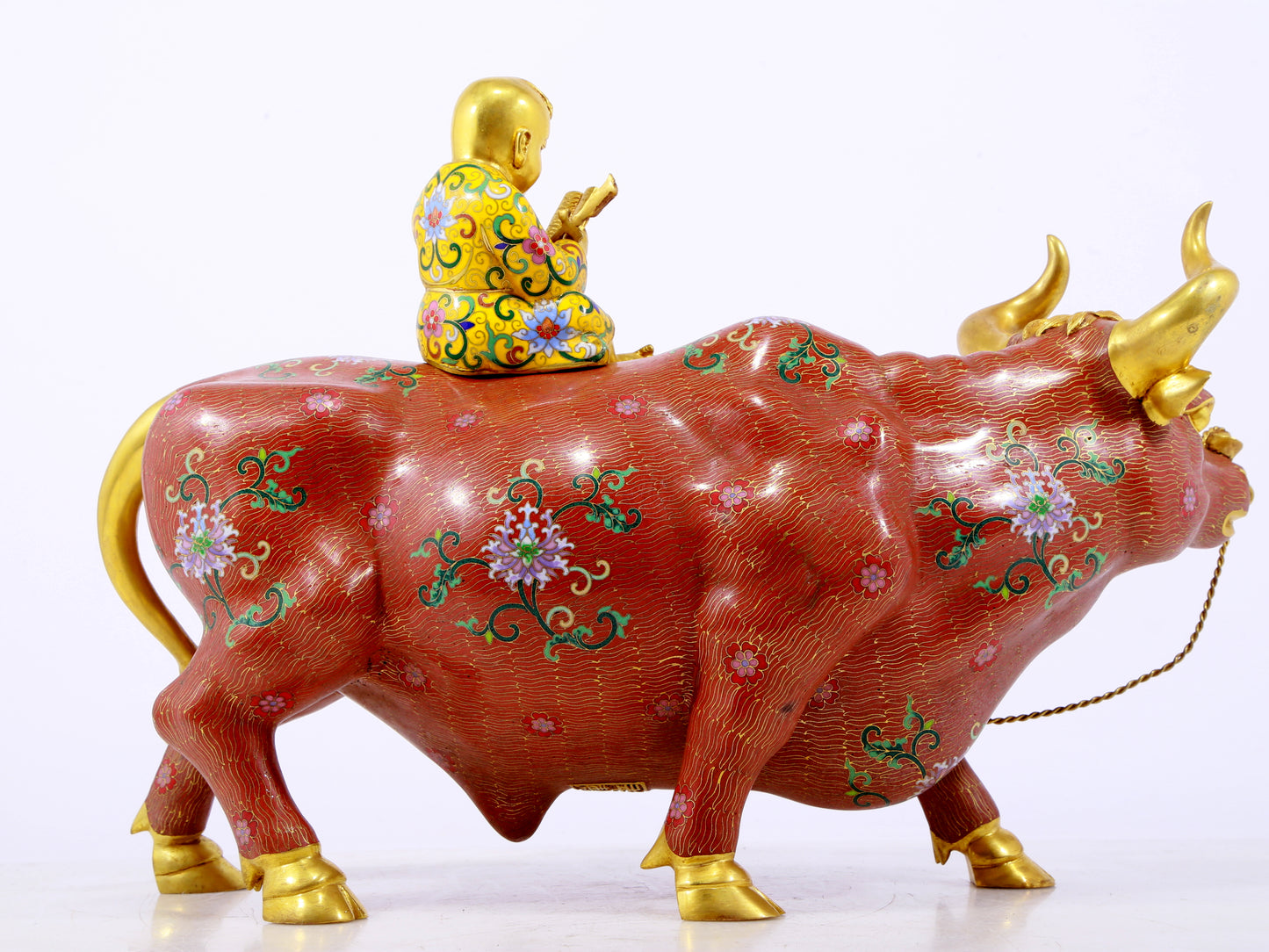 An exquisite cloisonné cow ornament