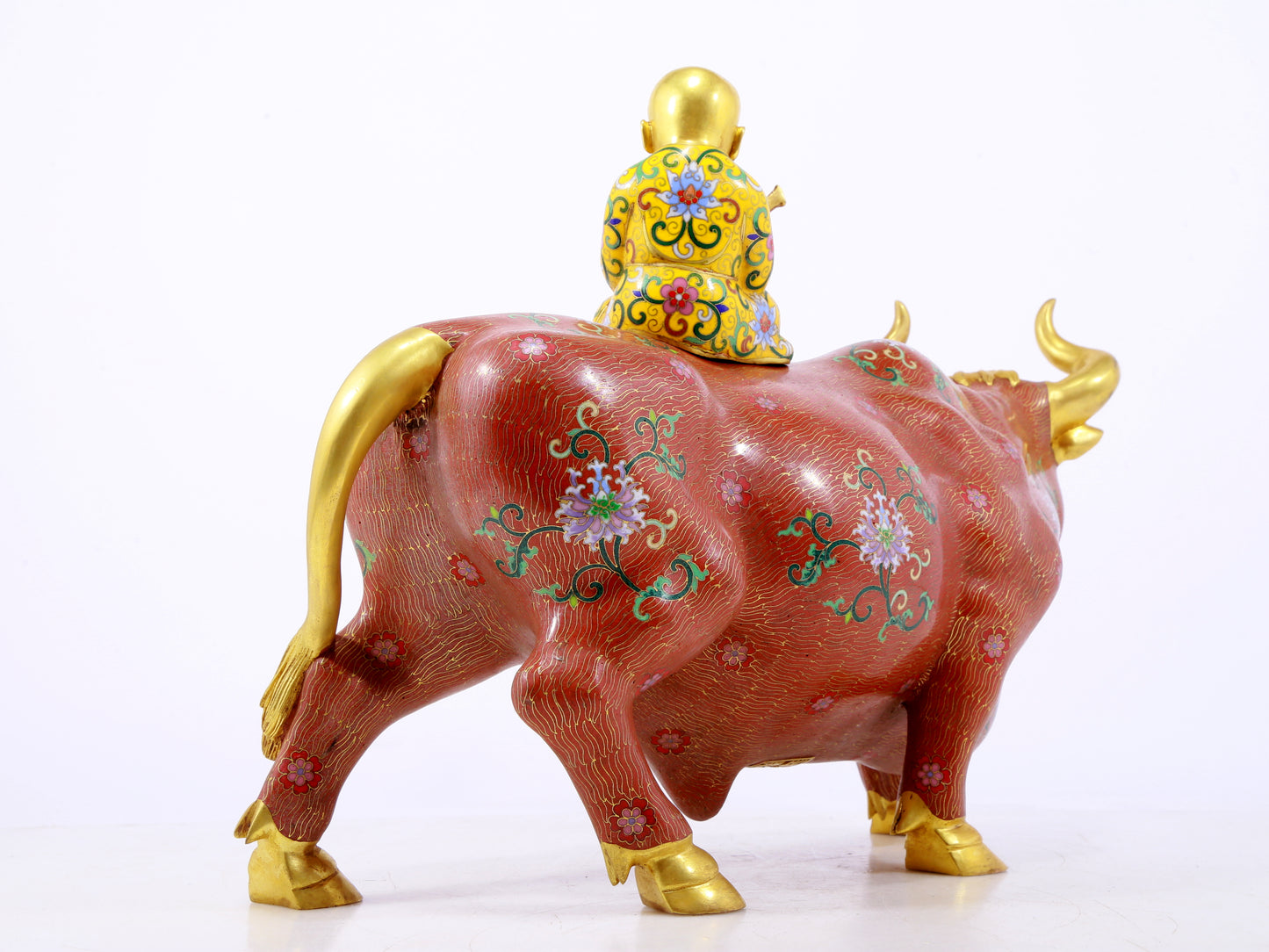 An exquisite cloisonné cow ornament