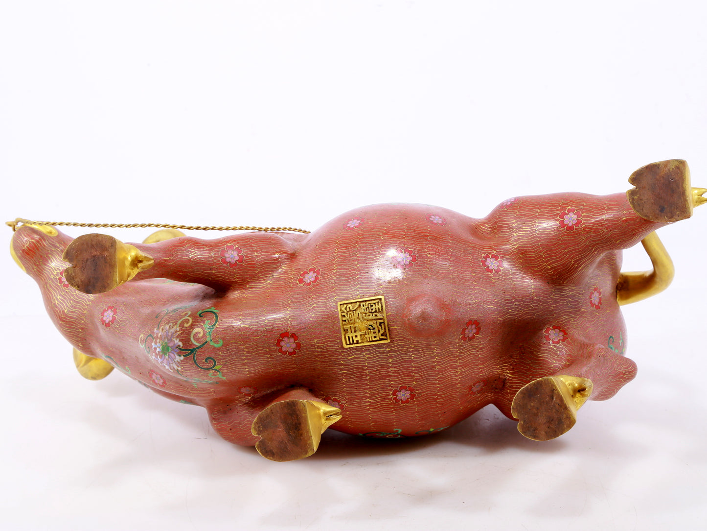 An exquisite cloisonné cow ornament