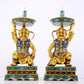 A stunning pair of cloisonné figure candlesticks