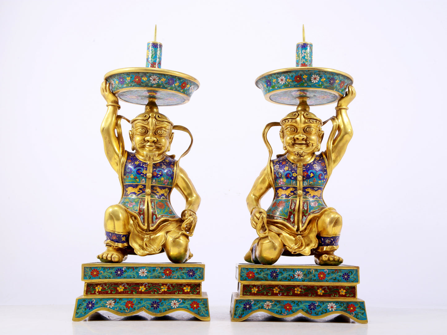 A stunning pair of cloisonné figure candlesticks