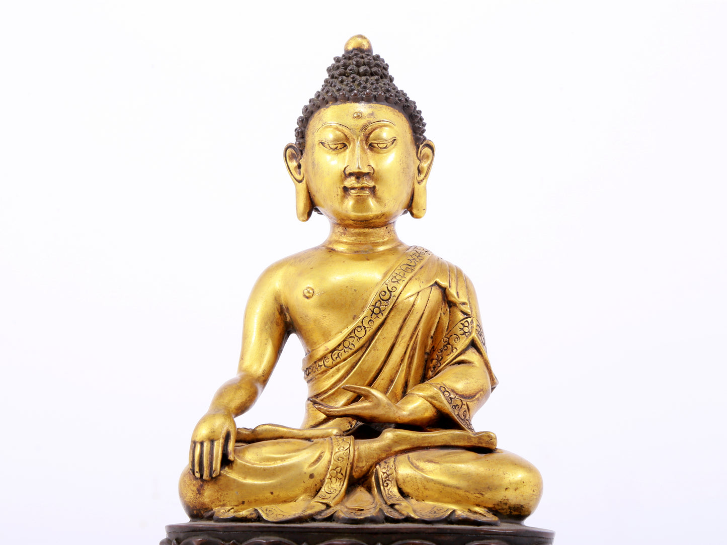 A sacred gilt bronze statue of Gautama Buddha