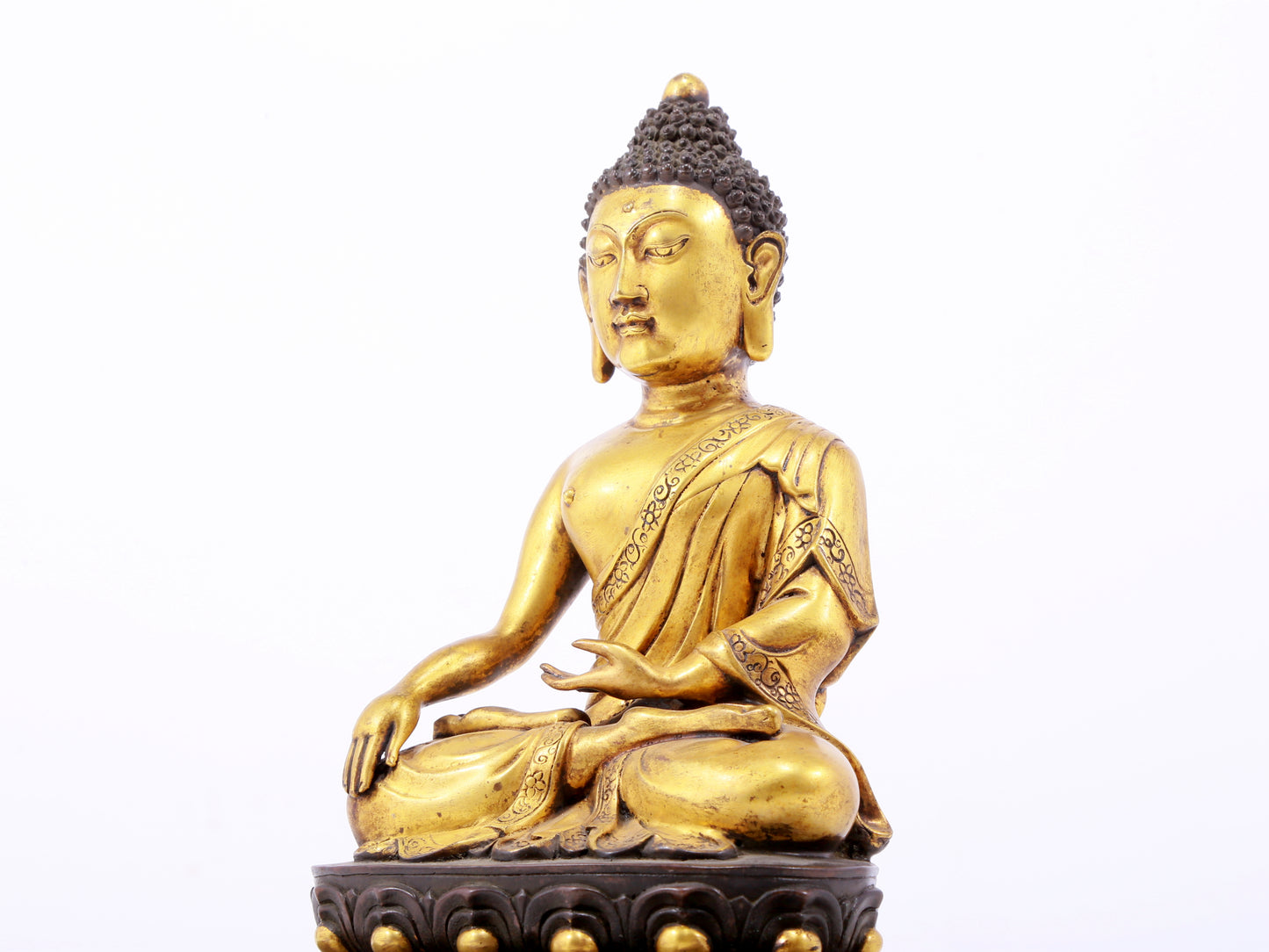 A sacred gilt bronze statue of Gautama Buddha