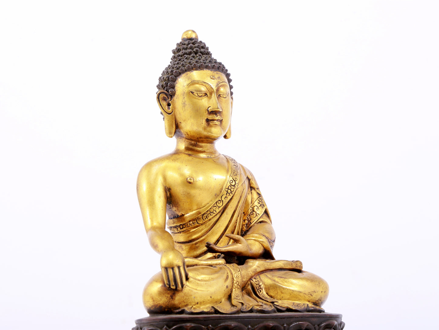 A sacred gilt bronze statue of Gautama Buddha