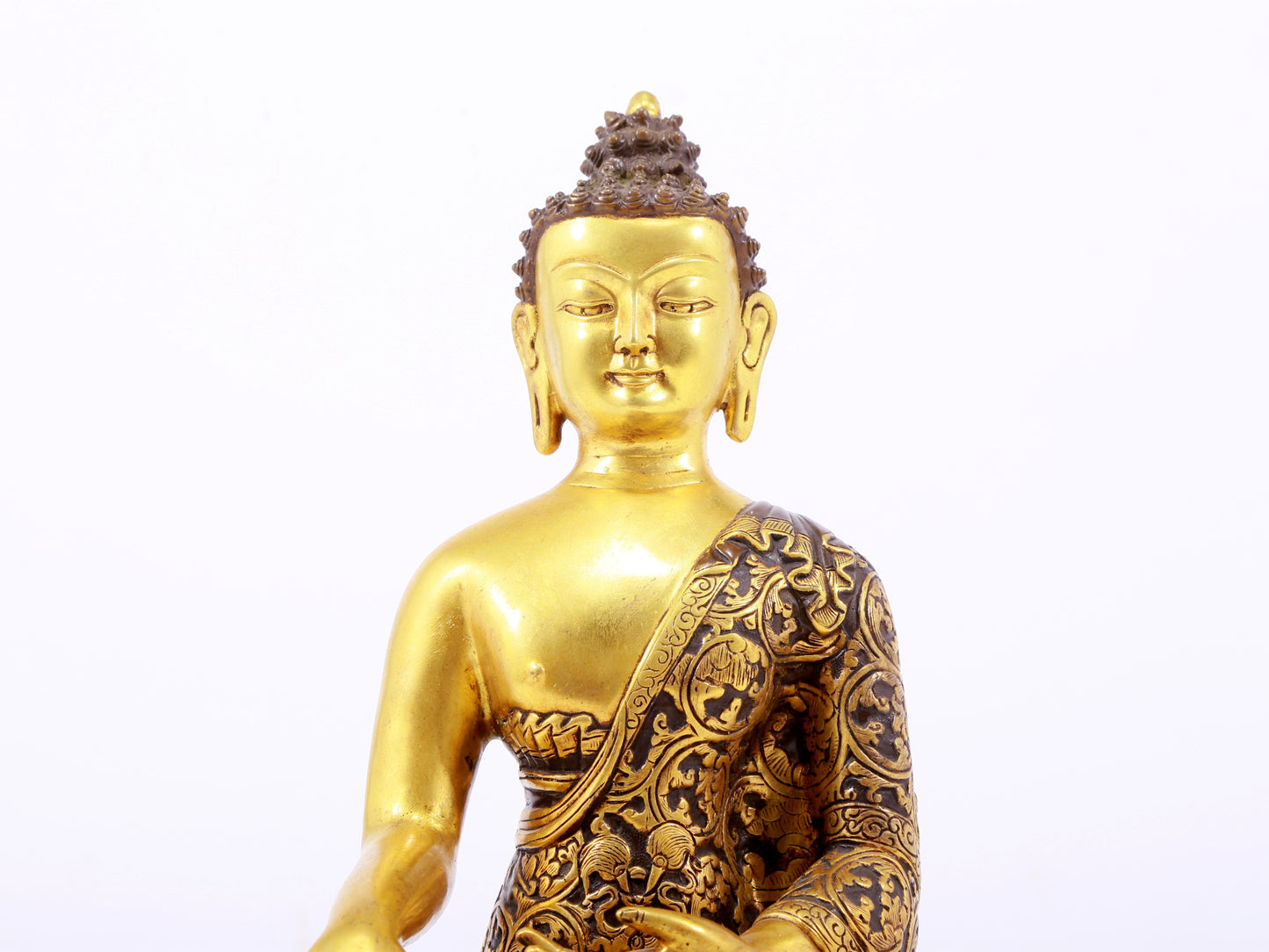 A sacred gilt bronze statue of Gautama Buddha