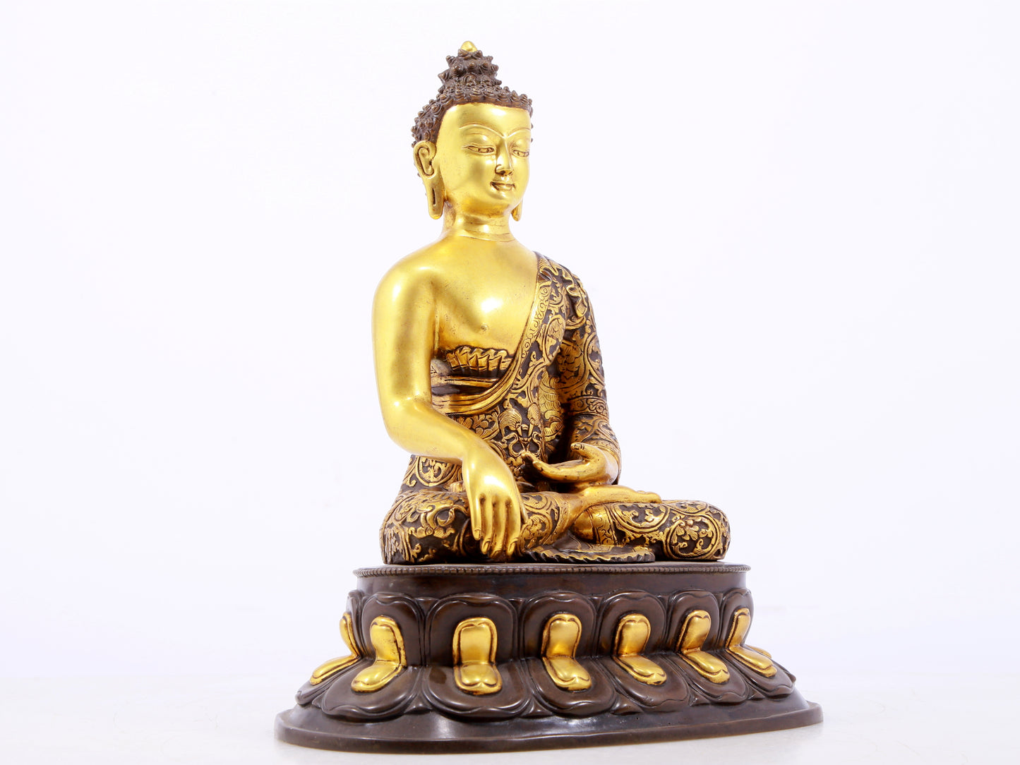 A sacred gilt bronze statue of Gautama Buddha