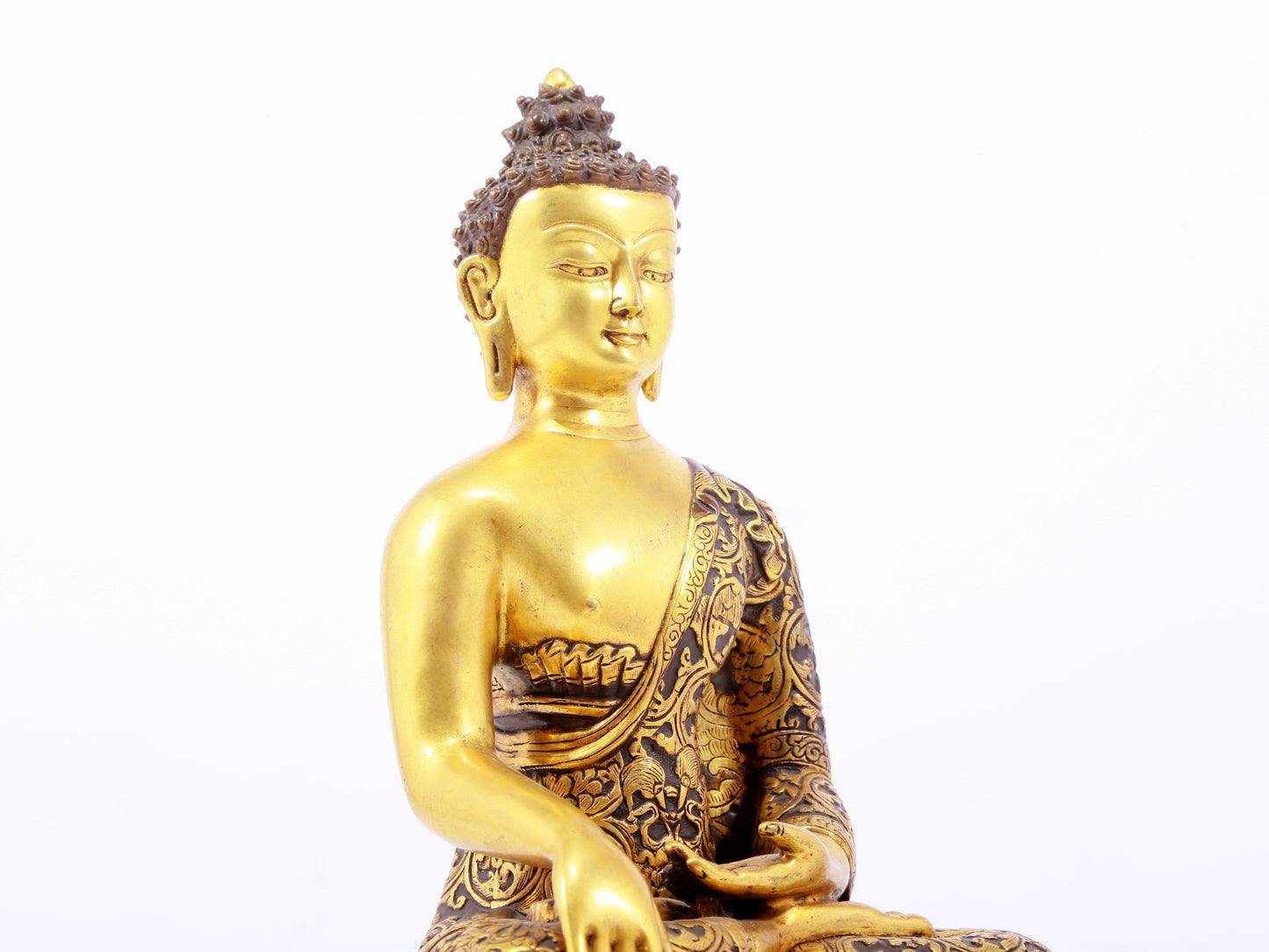 A sacred gilt bronze statue of Gautama Buddha